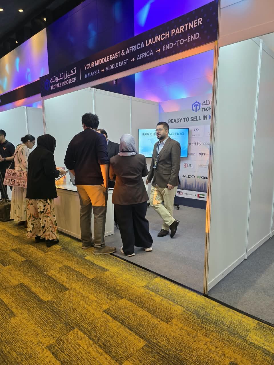 Visitors at the Techies Infotech stand at the Kuala Lumpur summit.